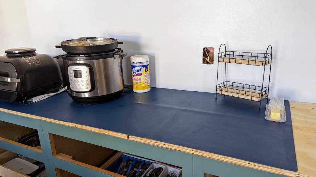 blue silicone mat on wood countertop in kitchen