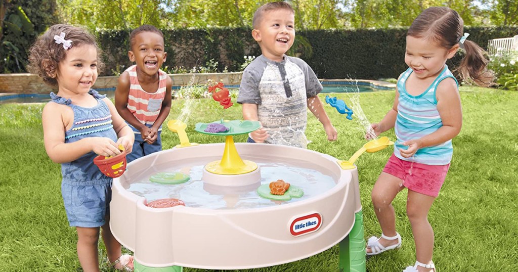 kids playing with little tikes frog pond water