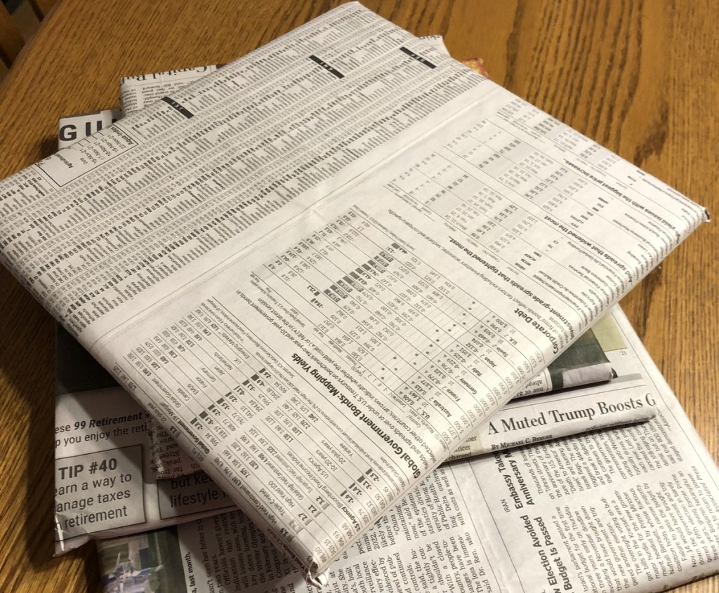 newspaper wrapped books