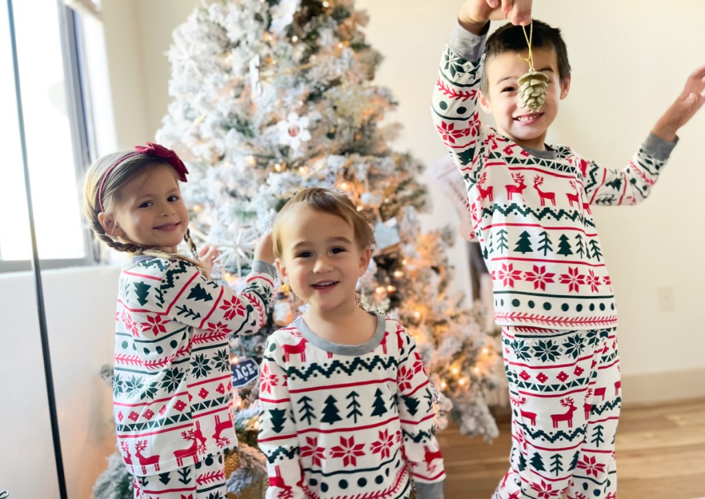 kids wearing christmas pajamas