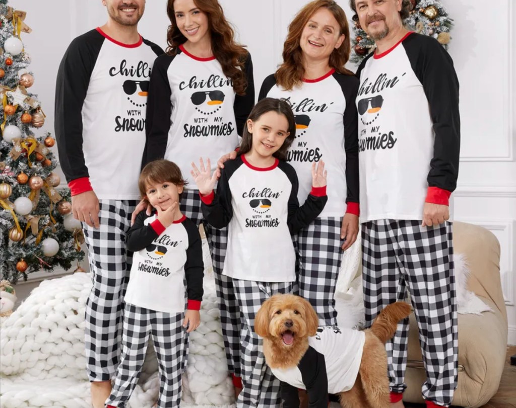 family with black and white snowman pajamas
