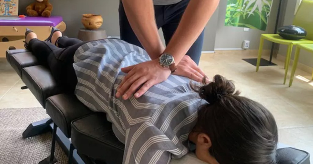 person laying on stomach getting a massage