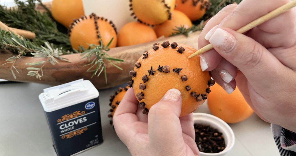 piercing oranges for cloves