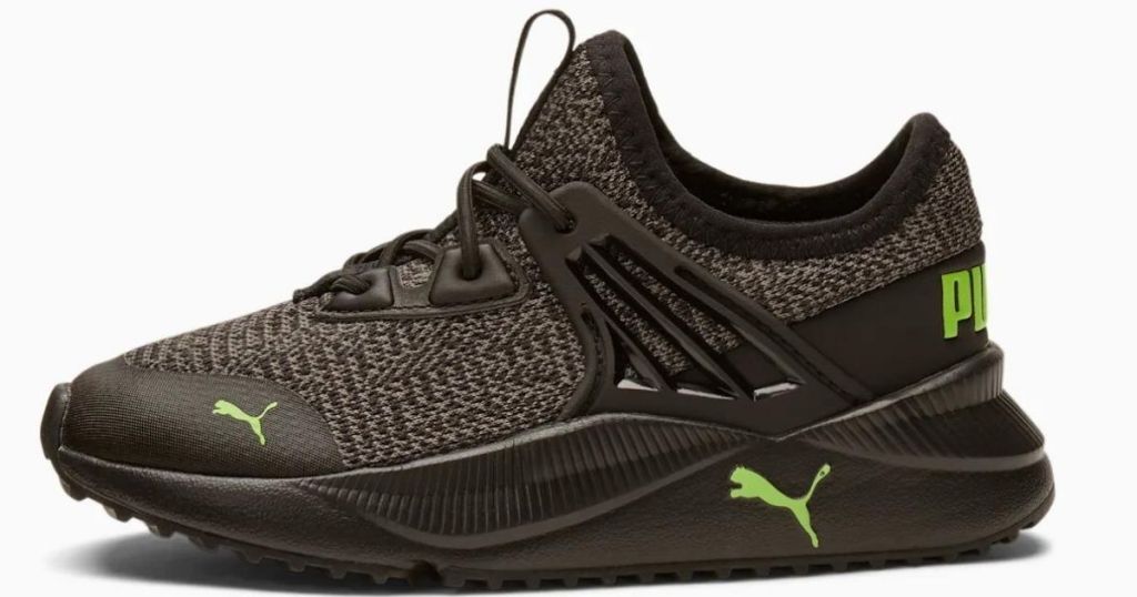 black knit Puma shoes with neon green accents