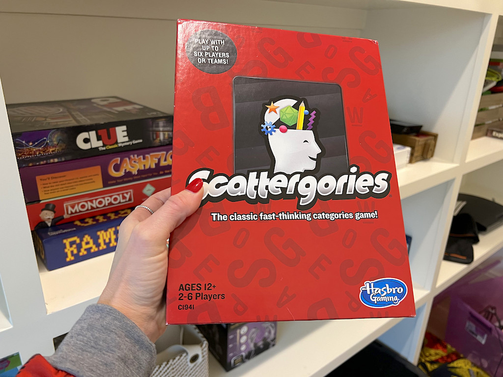 holding Scattergories board game 