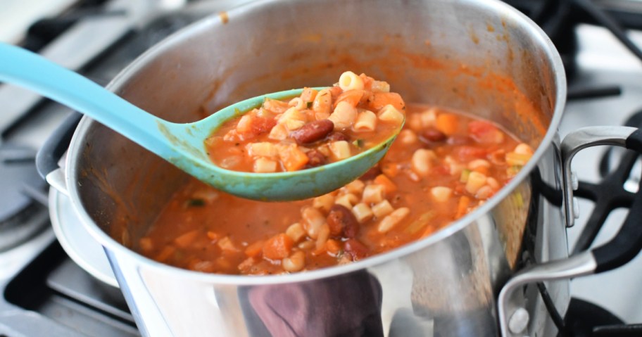 stirring minestrone soup