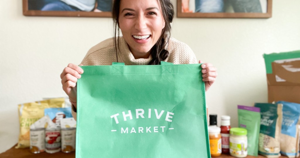 woman holding thrive market bag