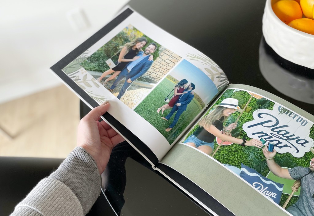 hand holding open photo book