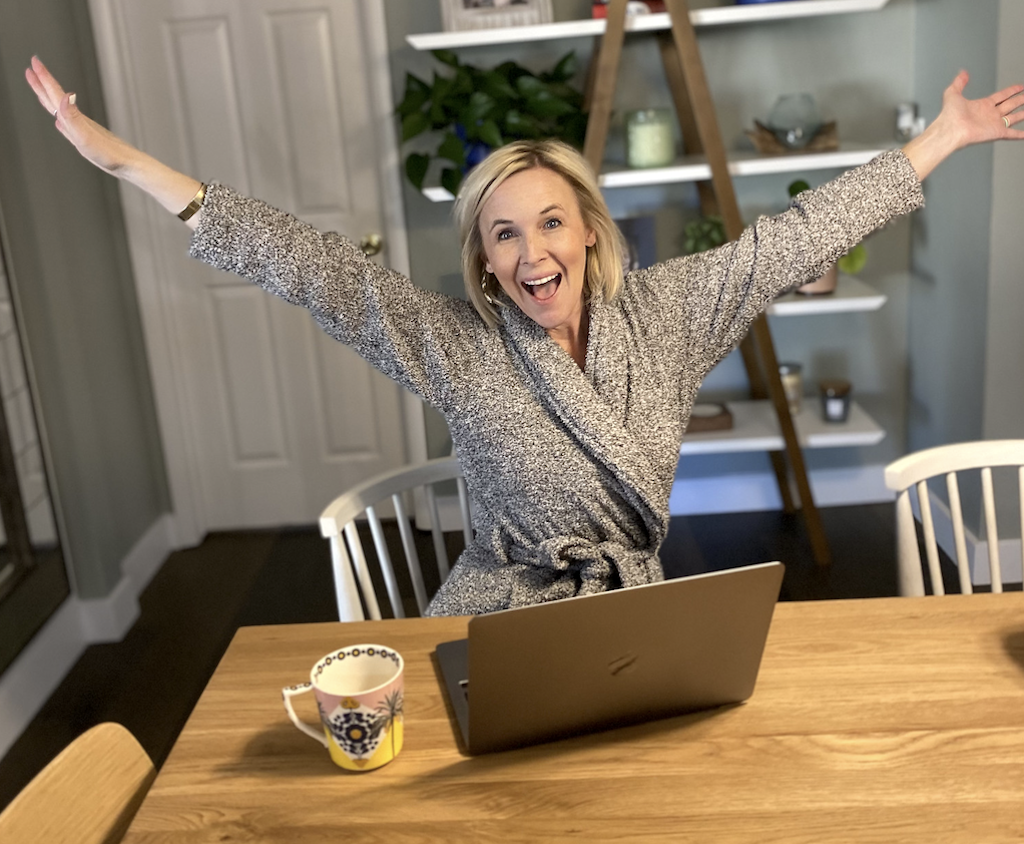woman on computer with robe and excited 