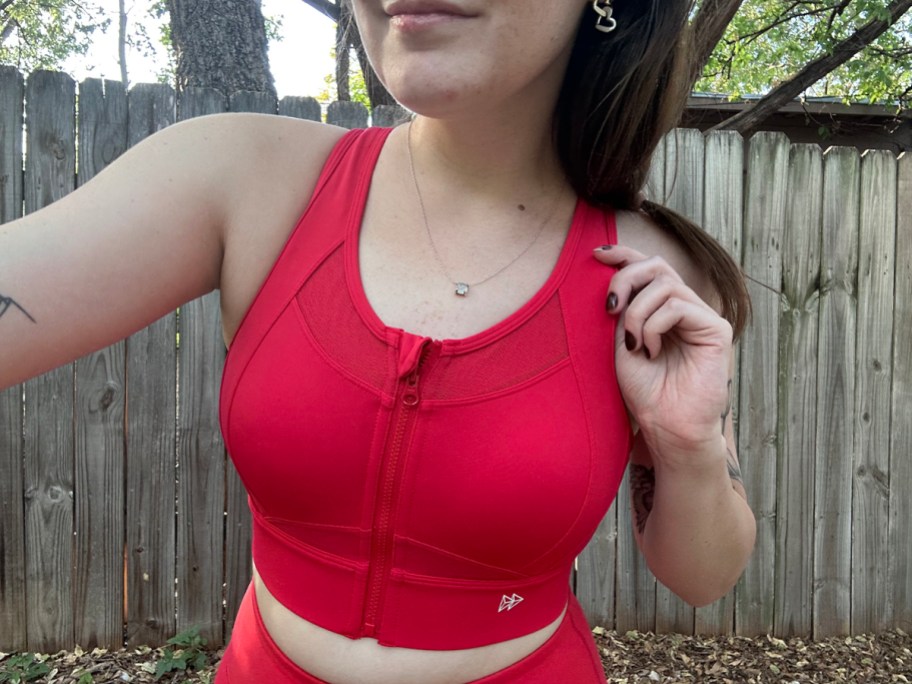 woman wearing red sports bra