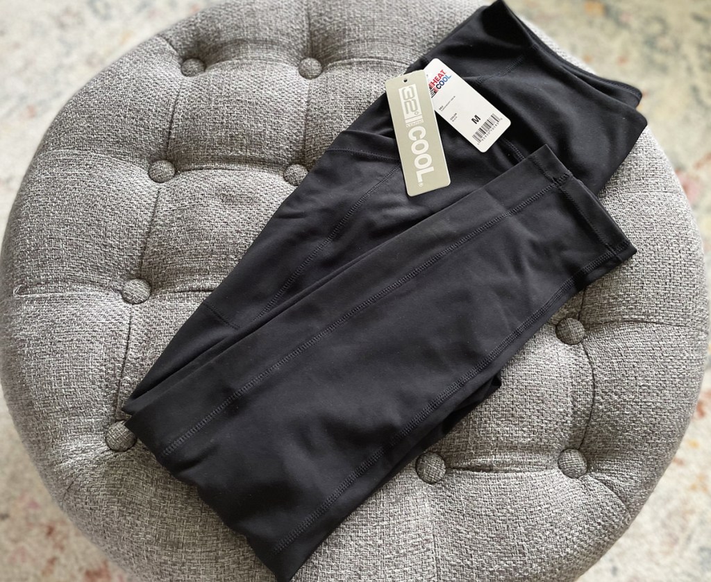 folded black pair of leggings