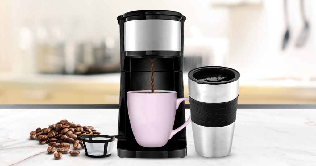 black coffee maker and travel mug on kitchen counter