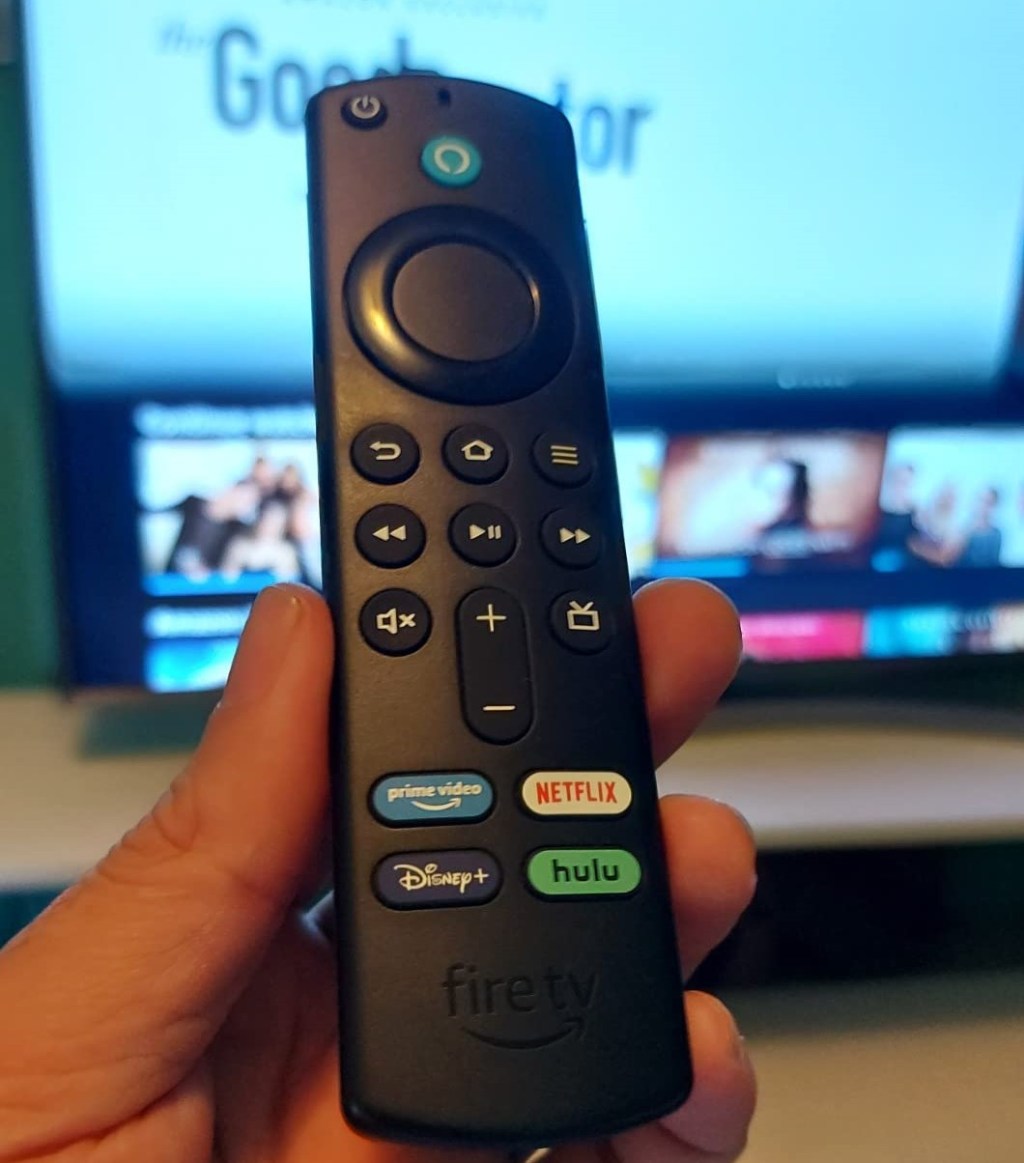 hand holding an Amazon Fire TV remote
