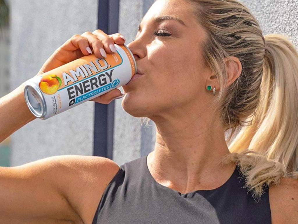 woman drinking optimum nutrition amino energy and electrolytes drink