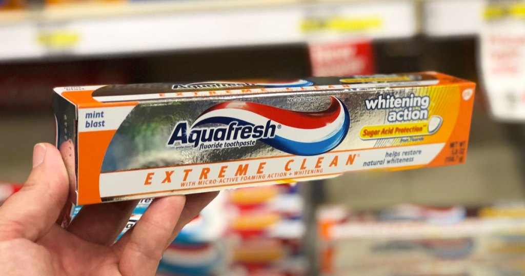 hand holding box of Aquafresh Extreme Clean Toothpaste