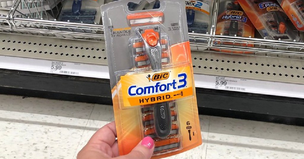 hand holding Bic comfort 3 razors in a store