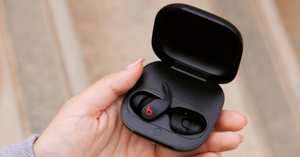 hand holding Beats Fit Pro Noise Cancelling Wireless Earbuds