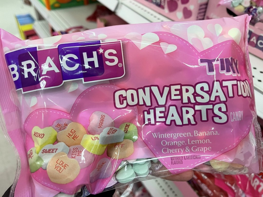 holding a bag of conversation hearts