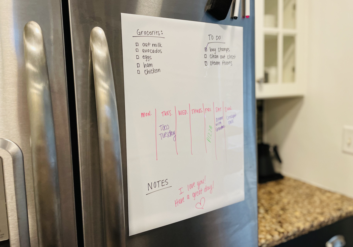 dry erase board on stainless steel fridge