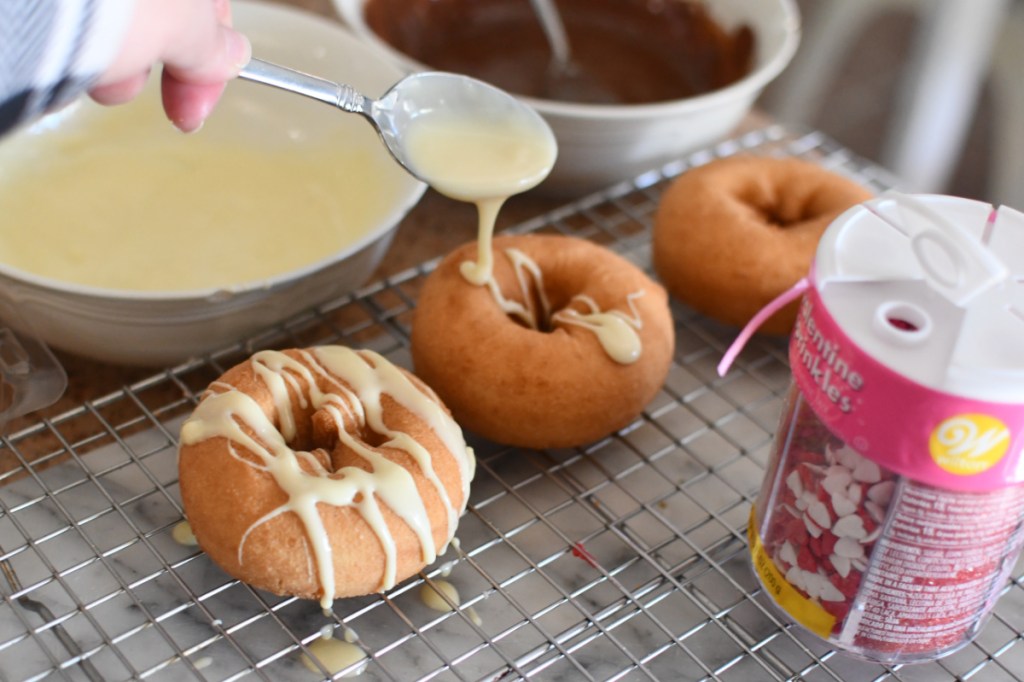 Decorating donut flowers with chocolate