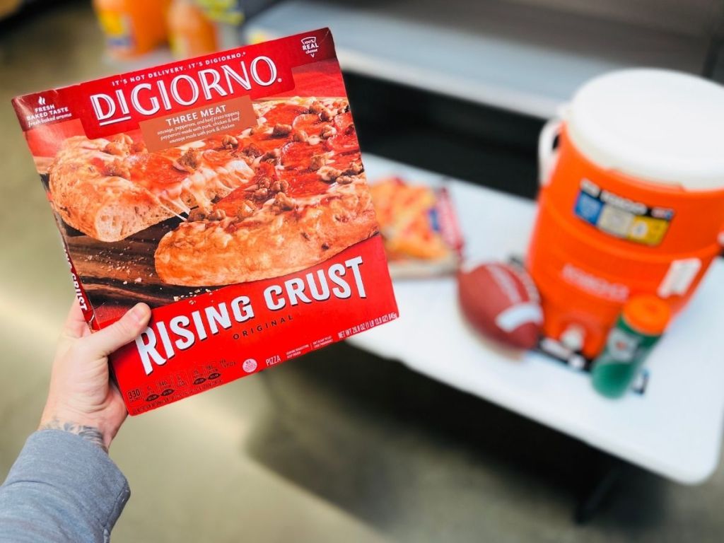hand holding Digiorno Rising Crust pizza