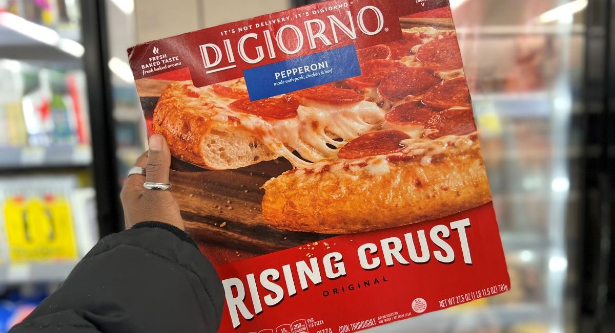 hand holding a Digiorno pizza