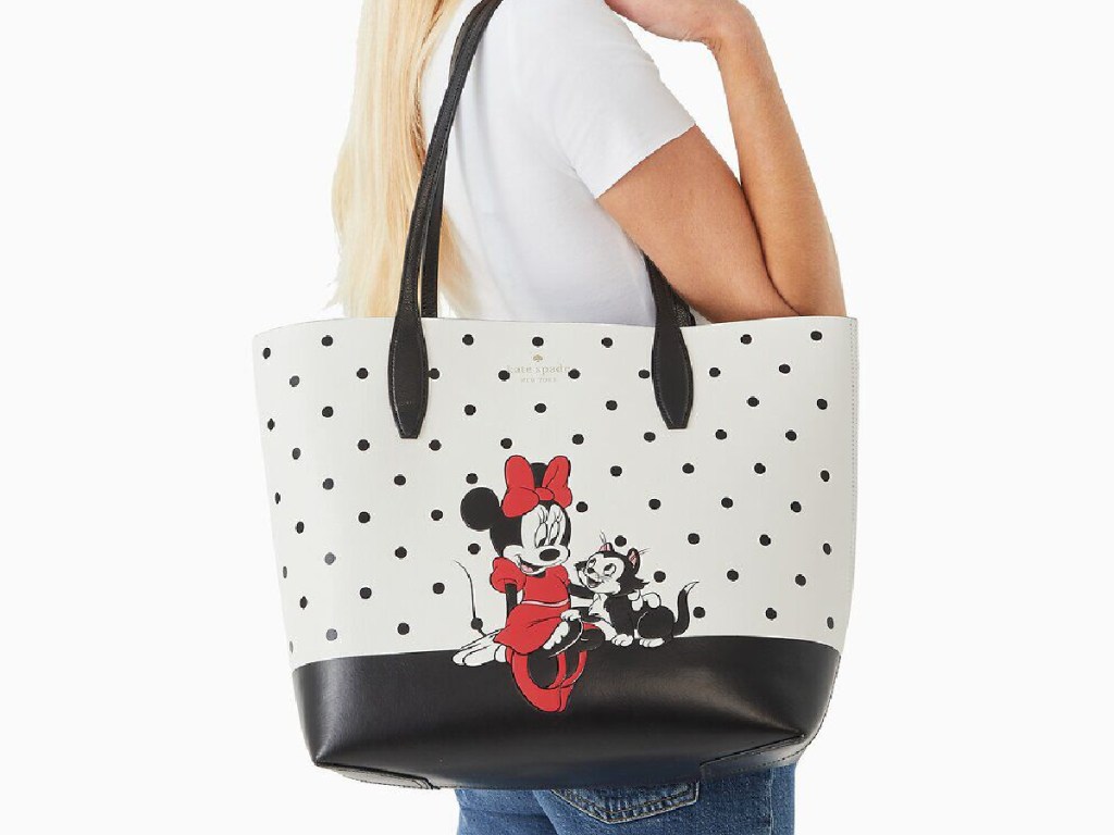 woman with black and white polka dot Minnie Mouse tote bag