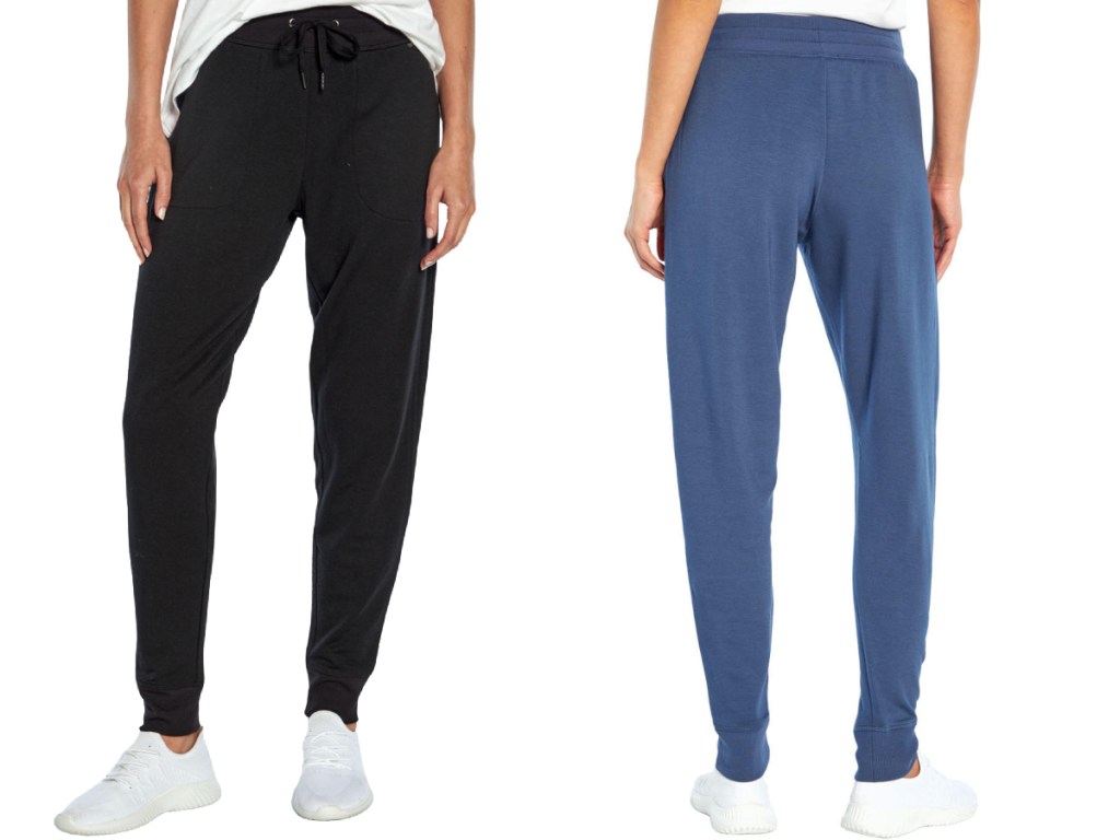 woman wearing black joggers and woman wearing navy joggers