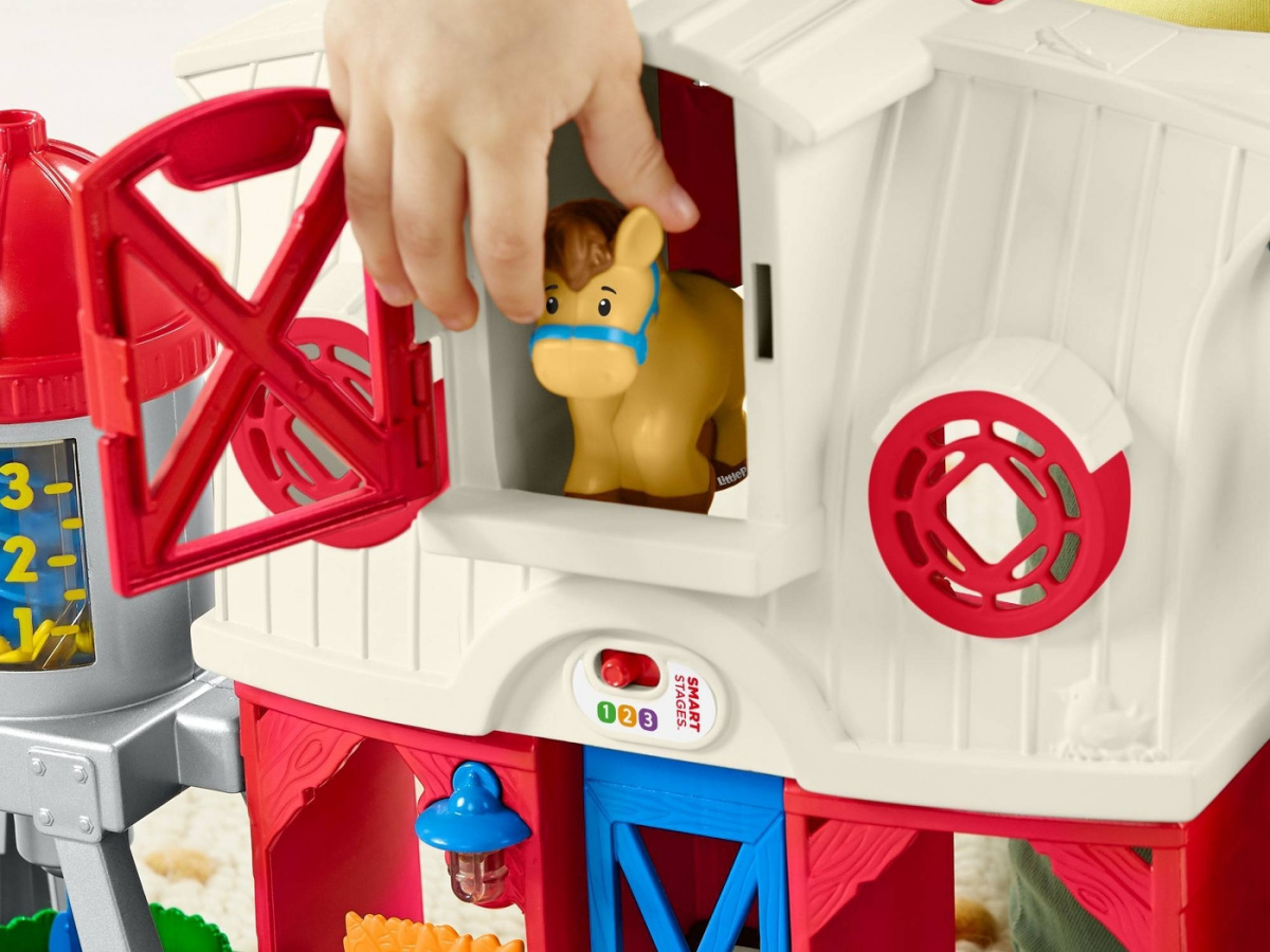 child playing with farm playset