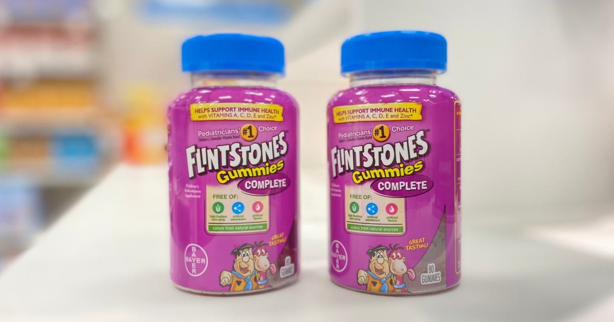 two bottles of flintstones childrens chewable multivitamin gummies on a counter