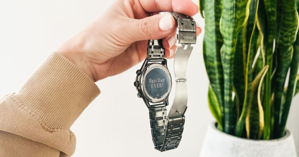 person holding "Best Dad EVER" egraved Fossil watch