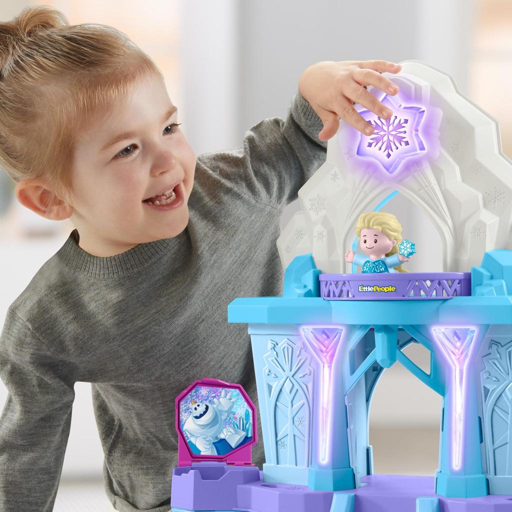 girl playing with Frozen Elsa Castle