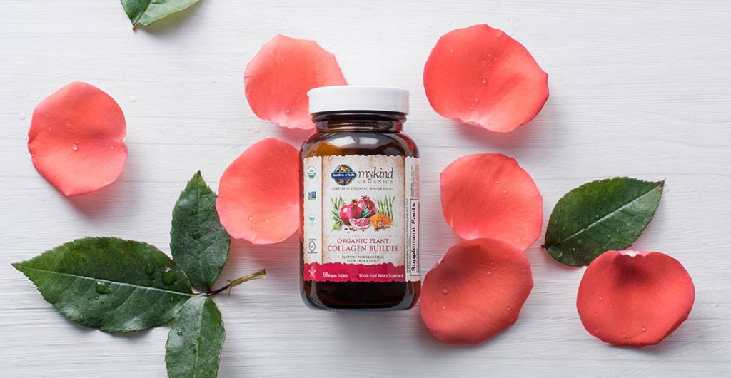 bottle of Garden of Life Organic Plant Collagen Builder with flower petals by it
