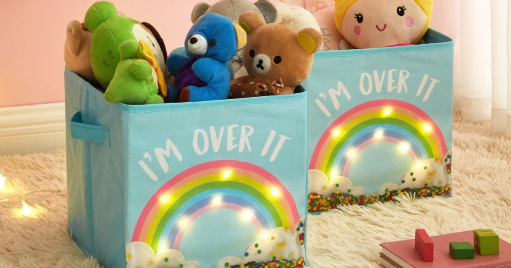 two rainbow storage cubes filled with toys