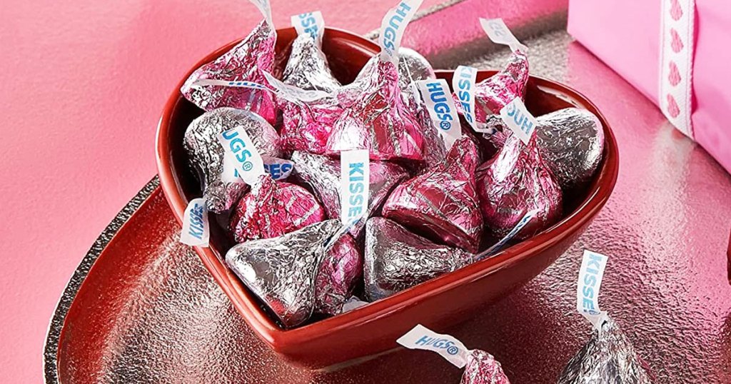 heart shaped bowl filled with Hershey's Hugs & Kisses