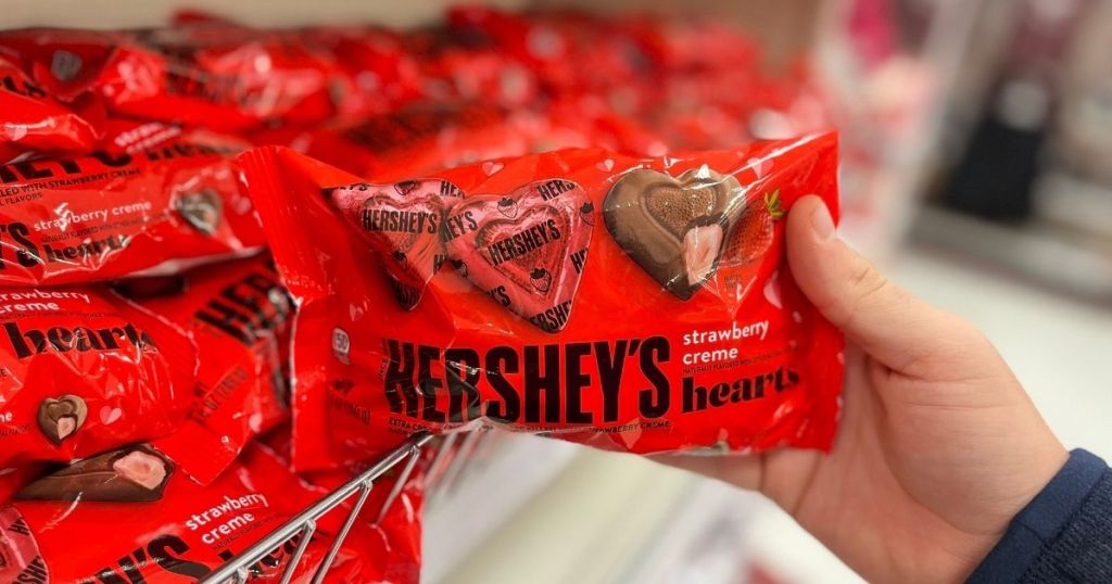 hand holding Hershery's Hearts Valentine's Day candy