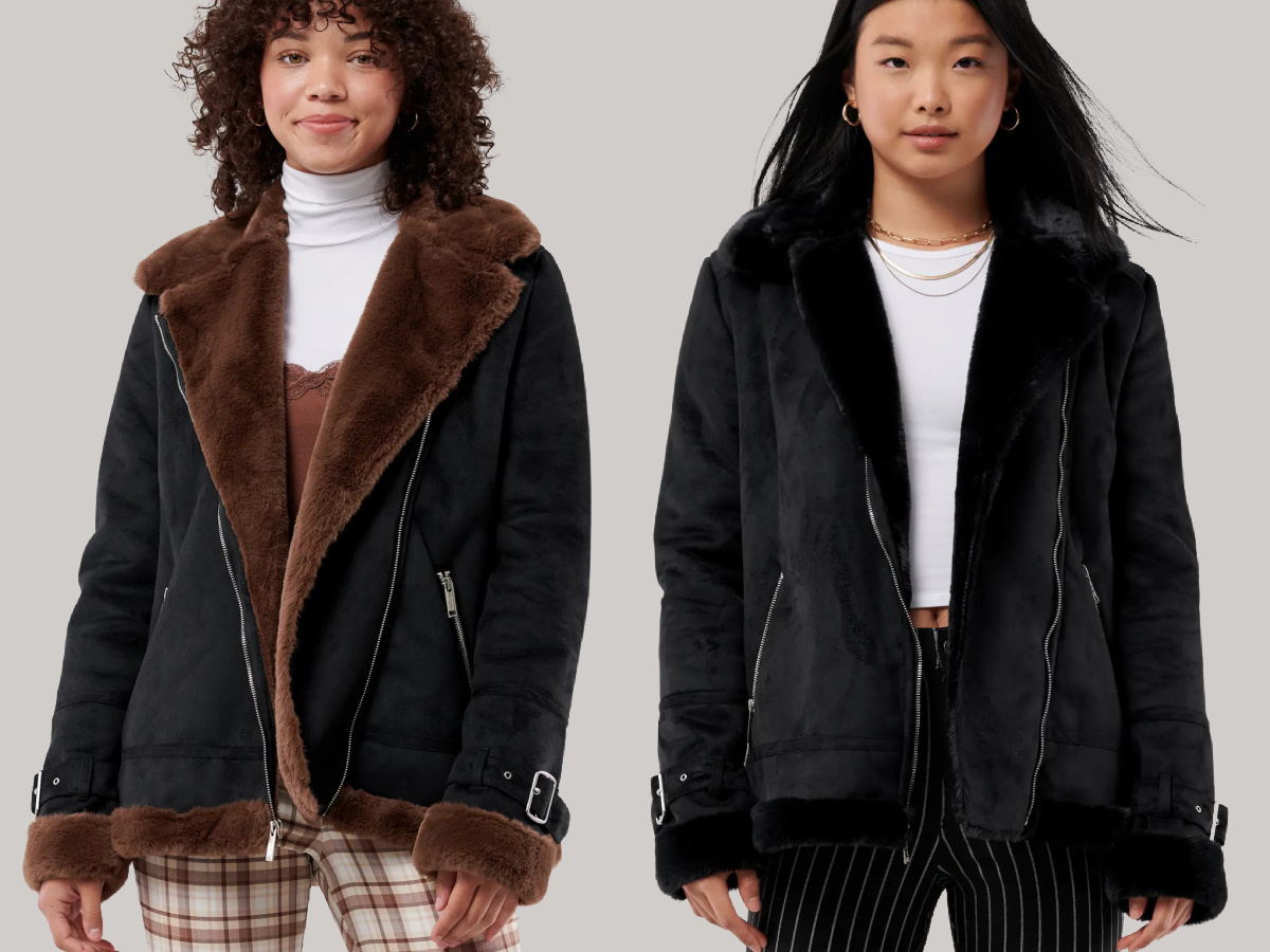 woman wearing black and brown faux shearling jacket and woman wearing black faux shearling jacket