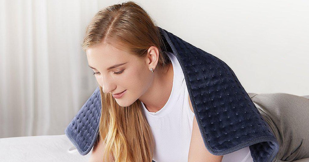 woman with a heating pad on her back