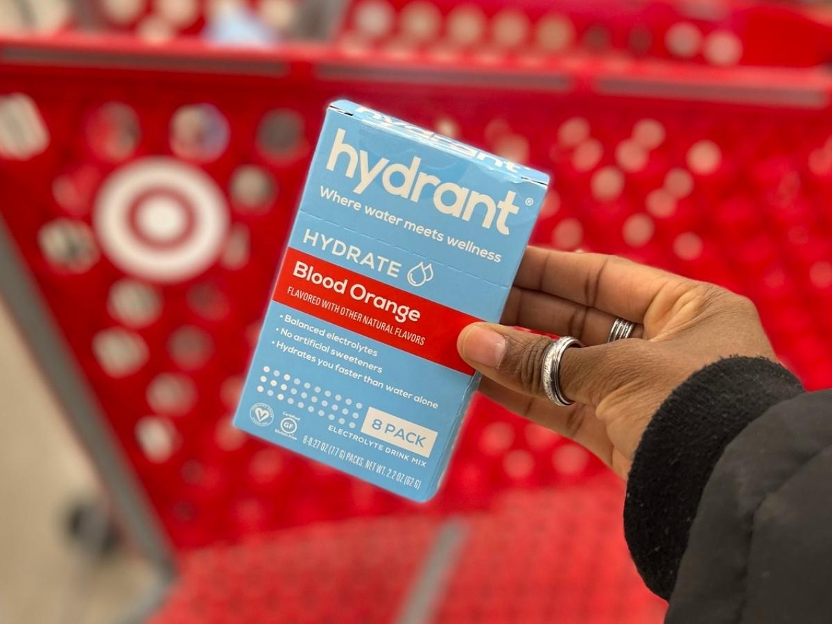 hand holding hydrant drink mix box in store