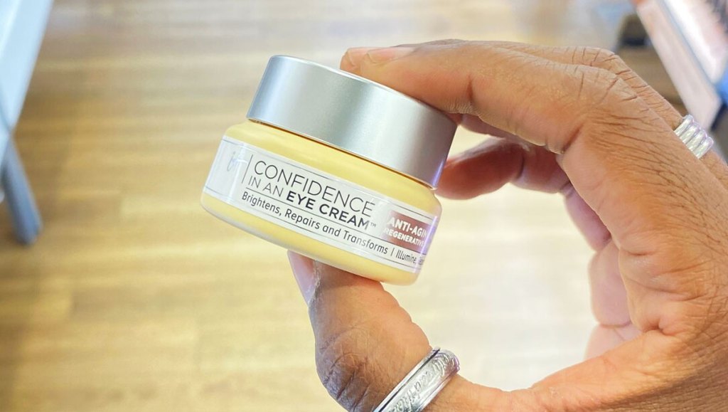 hand holding jar of It Cosmetics Confidence In An Eye Cream