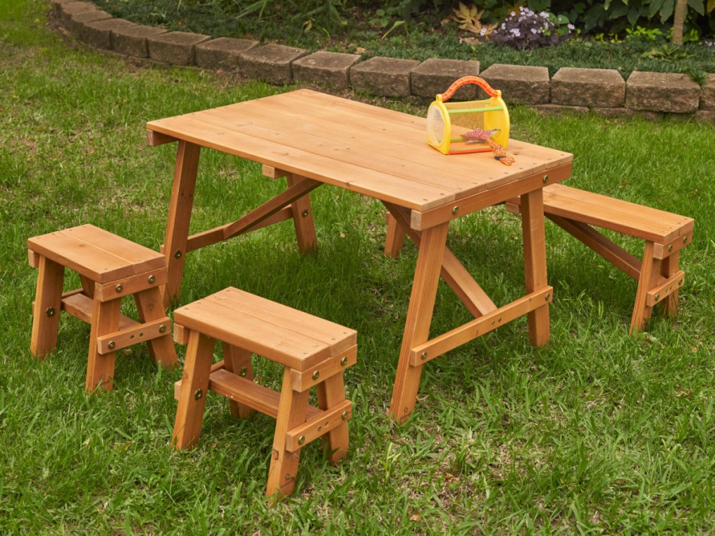 picnic table set outside in grass