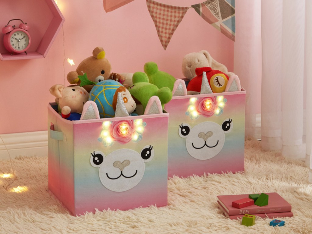 two unicorn storage cubes filled with toys