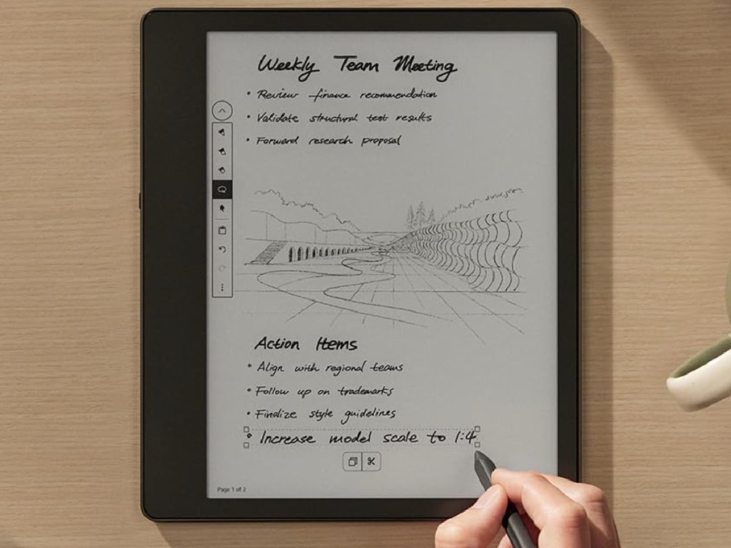 person taking meeting notes on kindle scribe