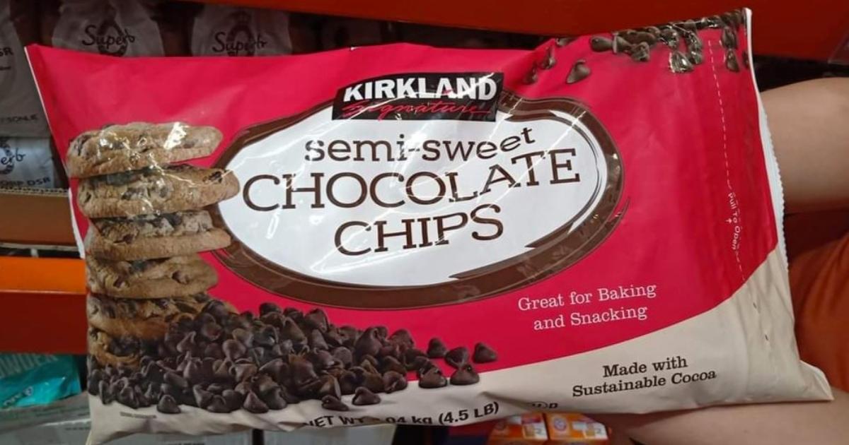 hand holding bag of kirkland semi sweet chocolate chips