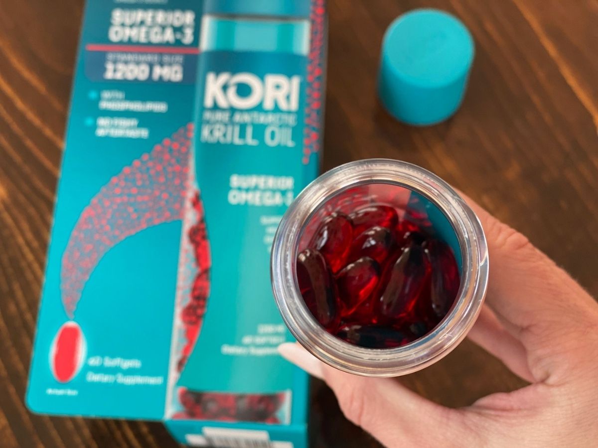 hand holding bottle of Kori Krill Oil Superior Omega-3 pills