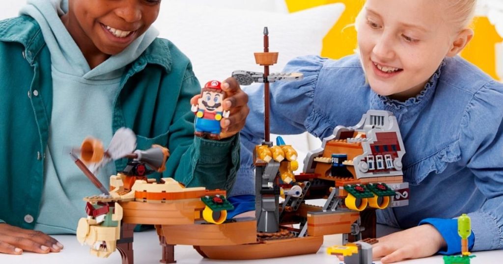 kids playing with LEGO Super Mario Bowsers Airship Expansion Set
