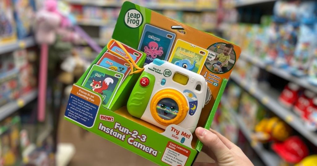 hand holding a LeapFrog Instant Camera