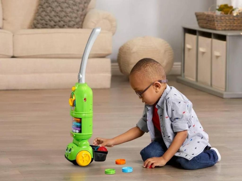 little boy with leapfrog pick up and count vacuum