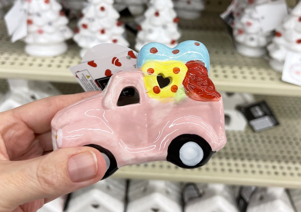 holding pink ceramic truck