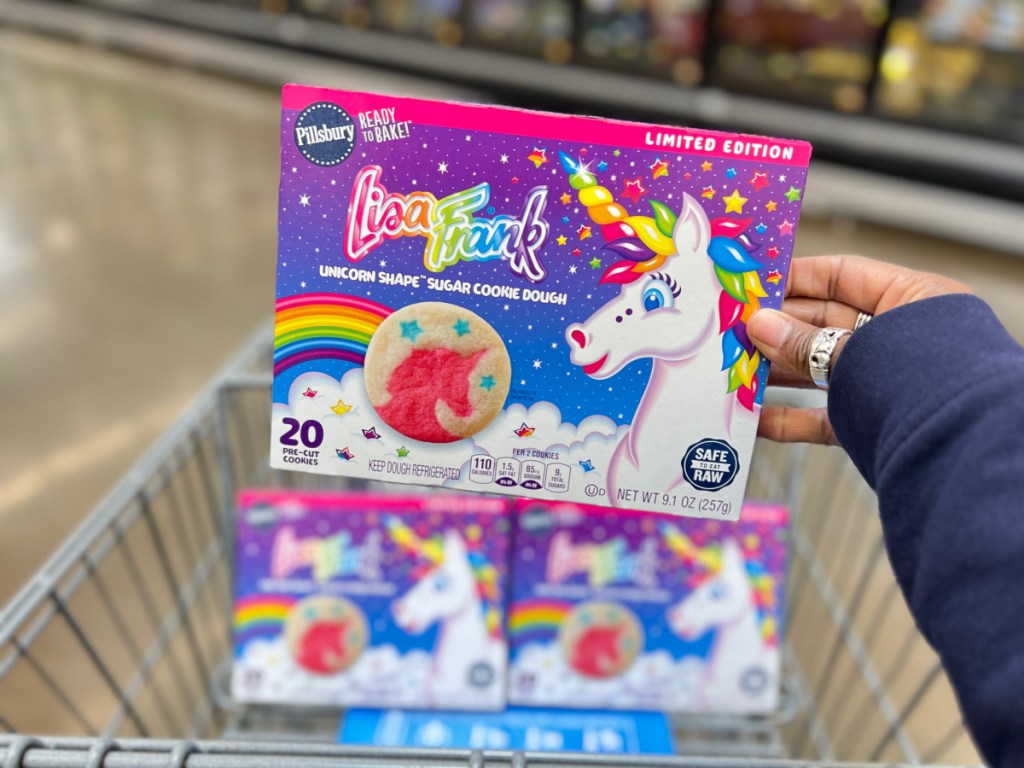 person holding box if Lisa Frank Unicorn Cookie Dough in walmart cart